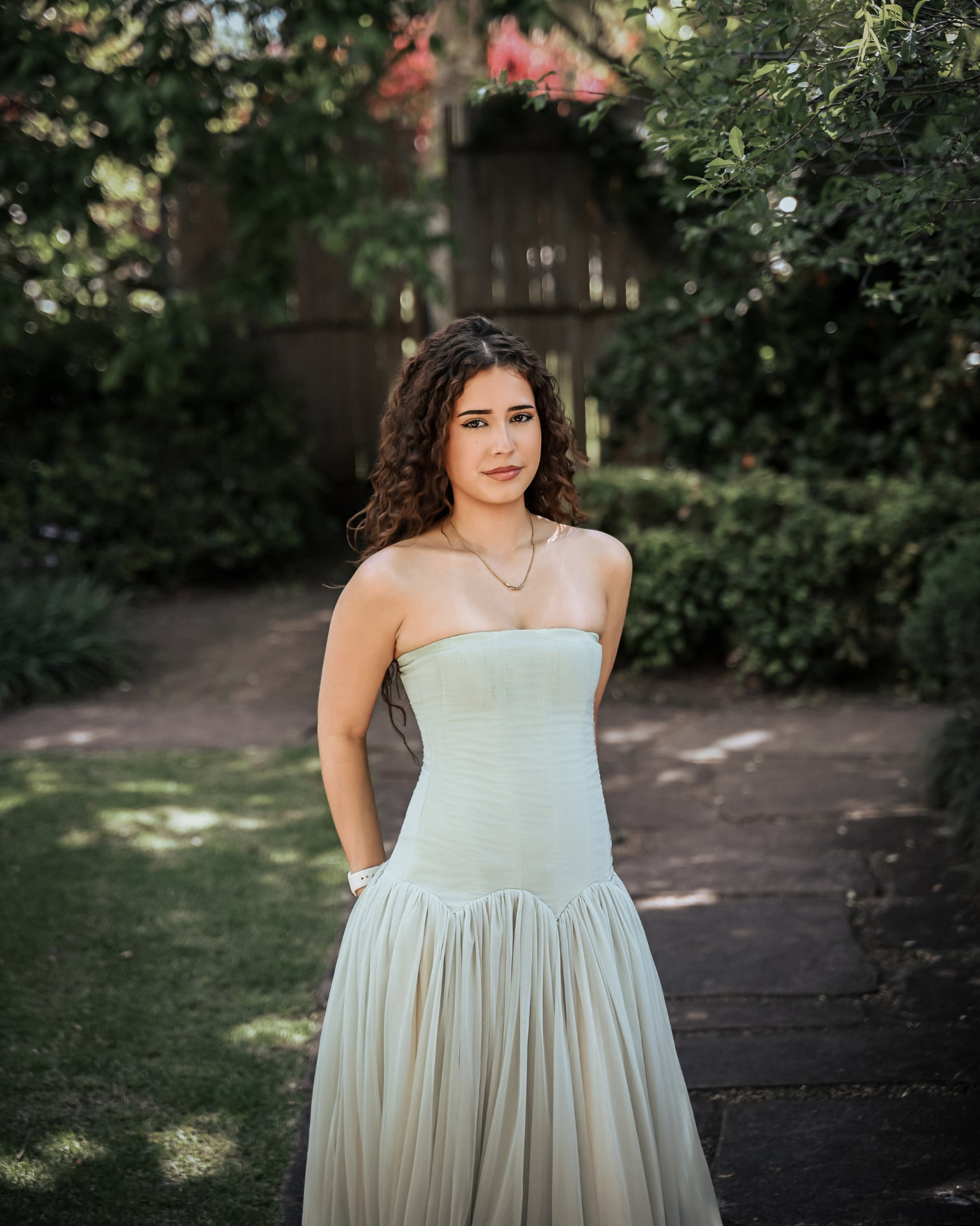 Portrait session in a garden, Adelaide, mint gown facing the camera